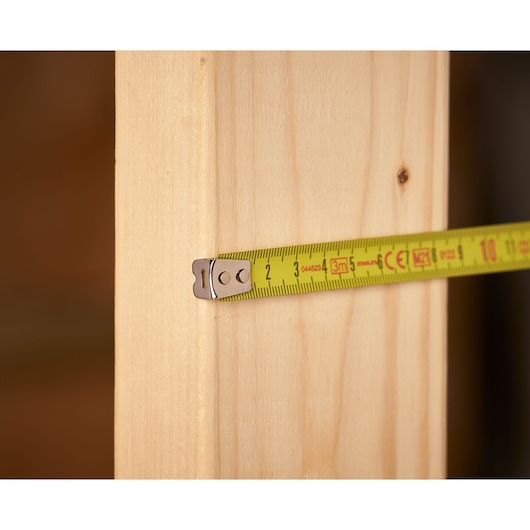 STANLEY 0-33-238 meetlint meet een houten plank, close-up fotografie.