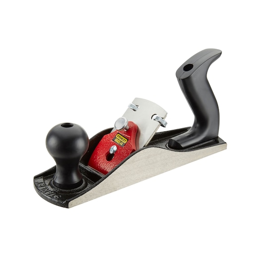 STANLEY 1-12-034 handschaaaf met zwarte handgrepen, rode kap en metalen basis, zijaanzicht op witte achtergrond.