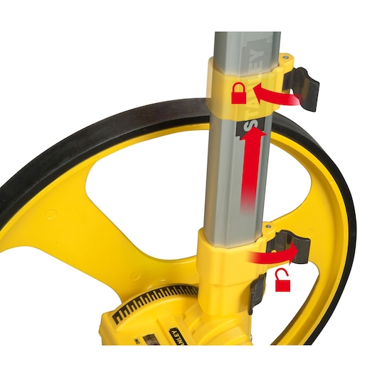 STANLEY 1-77-174 photographie de roue de mesure jaune avec verrou d’ajustement de poignée et flèches rouges, vue latérale.