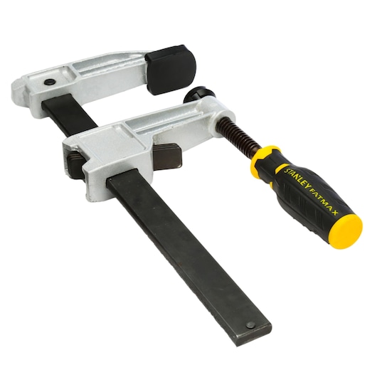 STANLEY FMHT0-83245 lijmklem met zwart-gele handgreep, schuin op witte achtergrond.