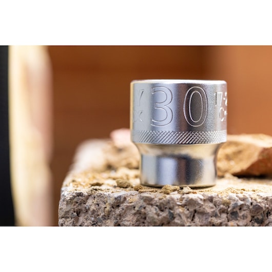Stanley FMMT17216-0 dopsleutel, close-up op ruwe ondergrond, zilverkleurige afwerking, fotografieproduct.