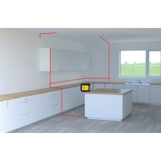 STANLEY STHT77502-1 laserwaterpas op keukeneiland, projecteert rode lijnen in moderne witte keuken, vooraanzicht.