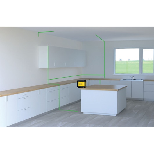 STANLEY STHT77592-1 laserwaterpas op keukeneiland, projecteert groene lijnen op witte kasten.
