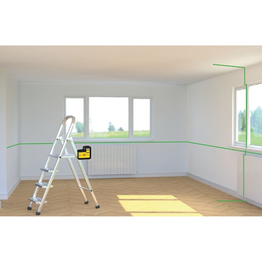 STANLEY STHT77594-1 laserwaterpas projecteert groene lijnen in een lichte kamer, frontaal met ladder.